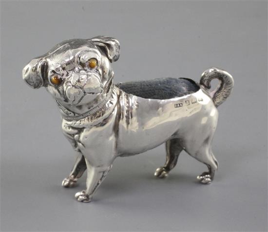 A George V novelty silver pin cushion modelled as a pug by Crisford & Morris, height 2.25in.